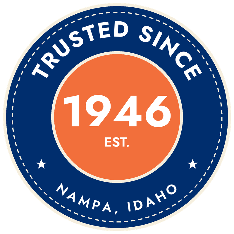 Circular seal badge with dark blue outer ring, white dashed border, orange center circle displaying 1946 EST., and text reading Trusted Since and Nampa, Idaho.